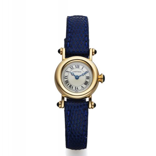 CARTIER REF. 1470 DIA BOLO. Cartier, "Diabolo Louis Cartier" case No. C 64338, Ref.. 1470-1. Made in the 1990's.. Fine and elegant, water-resistant, 18K yellow gold and. sapphire lady's quartz wristwatch with an 18K yellow gold. Cartier buckle.