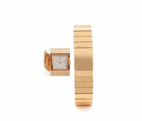 PATEK PHILIPPE REF. 3086 YELLOW GOLD. Patek Philippe, Genève, No. 1101114, case No. 2609796. Ref. 3086. Made circa 1960s.. Fine and unusual, square "bombé", manual-winding. 18K guilloché yellow gold lady's wristwatch with. concealed dial and matching brac