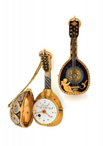 THE MANDOLIN.Des Arts Pére fils & Cie, (Genève). Made circa 1810..Fine and rare, 18K gold and enamel form watch with concealed dial and visible.balance, designed as a mandolin. Accompanied by a gold ratchet key.