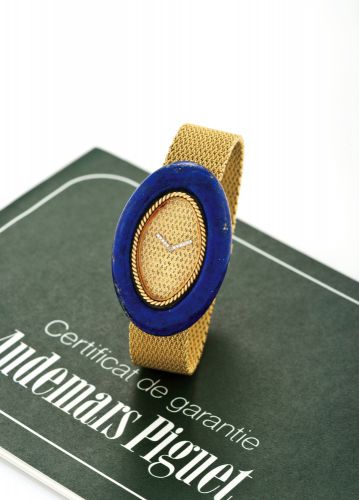 AUDEMARS PIGUET YELLOW GOLD AND LAPIS LAZULI.Audemars Piguet, Geneve, movement No. 116446, case No. 65367, Ref. 8455. Sold.on April 5th, 1977..Fine and elegant, 18K yellow gold and lapis lazuli lady's wristwatch with.diamond-set hands and an integral 18K 
