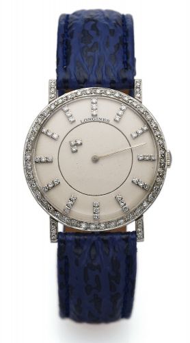 LONGINES REF. 167B-528 MYSTERY, WHITE GOLD & DIAMONDS.Longines, cased by Longines-Wittnauer Watch Co., New York-.Montreal, movement No. 50755291, case No. 884083, Ref. 167B-528..Made in the 1950s..Fine and unusual, 18K white gold and diamond wristwatch.