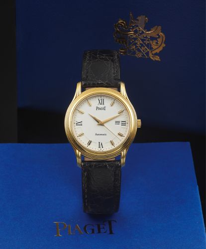 PIAGET REF. 24001 YELLOW GOLD AUTOMATIC.Piaget, Automatic, case No. 631011, Ref. 24001 M 501 D. Made in.the 1990s..Very fine, center seconds, self-winding, water-resistant, 18K.yellow gold wristwatch with date and an 18K yellow gold Piaget.buckle.