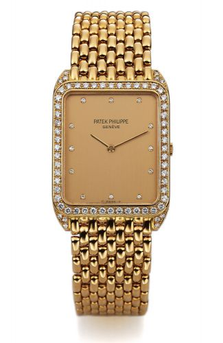 PATEK PHILIPPE REF. 3809 YELLOW GOLD.DIAMONDS.Patek Philippe, Genève, No. 1370077, case No. 2821240.Ref. 3809-2. Made circa 1990..Very fine and rare, rectangular, thin, 18K yellow gold and diamonds.wristwatch with an 18K yellow gold Patek Philippe link br