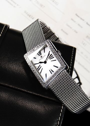 VACHERON CONSTANTIN REF. 25520.ASYMMETRIC.DIAMOND AND WHITE GOLD.Vacheron Constantin, Genève, '' Asymmetric'' No. 944434.case No. 756987, Ref. 25520. Made circa 2000s..Fine and rare, asymmetric and curved, 18K white gold and.diamonds lady's quartz wristwa