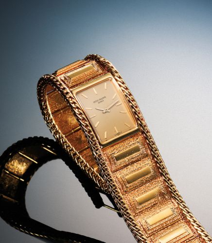 PATEK PHILIPPE REF. 4241 YELLOW GOLD.Patek Philippe, Genève, No. 1277079, case No. 2742947, Ref. 4241-4..Made circa 1970..Very fine and elegant, 18K yellow gold rectangular wristwatch with.an integral Patek Philippe yellow gold bracelet.