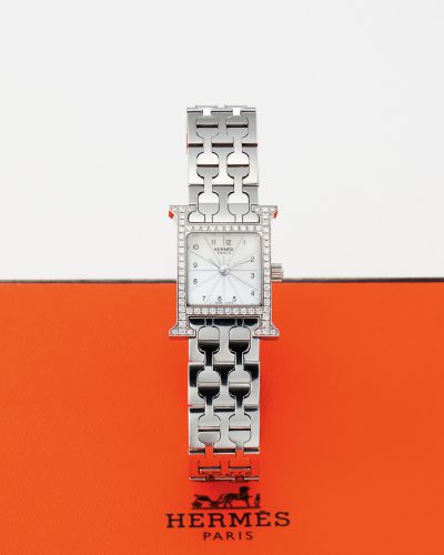 HERMES REF. HH1.130 MOTHER OF PEARL.DIAMOND AND STEEL.Hermès, Paris, H watch, case No. 2736358, Ref. HH1.130. Made circa 2000..Fine and elegant, H shaped case, stainless steel and diamonds lady's quartz wristwatch with stainless steel Hermès bracelet and 