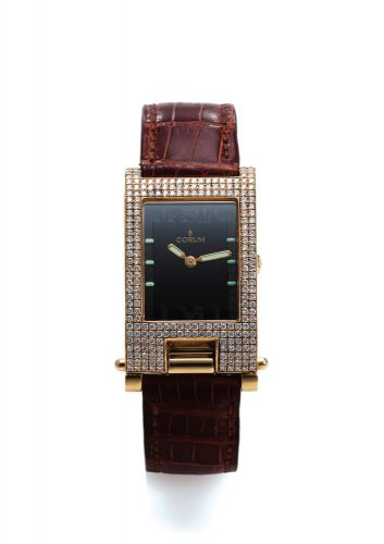CORUM REF. 64. 151. 56 TABOGAN.DIAMOND AND YELLOW GOLD.Corum, Tabogan, Ref. 64.151.56. Made circa 1990s..Fine and unusual, water-resistant, asymmetric, rectangular curved.diamond and 18K yellow gold quartz wristwatch bearing a sliding.and hinged mechanism