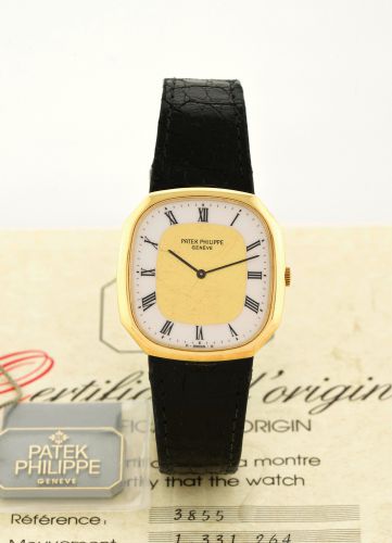 PATEK PHILIPPE, REF. 3855, ENAMEL AND GOLD DIAL.Patek Philippe, Genève, movement No. 1331264, Ref. 3855. Made in July 1987..Fine and rare, octagonal, 18K yellow gold wristwatch with enamel chapter ring and with an 18K.yellow gold Patek Philippe buckle. Ac