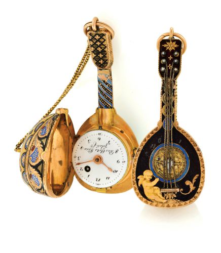 THE MANDOLIN.Des Arts Pére fils & Cie, (Genève). Made circa 1810..Fine and rare, 18K gold and enamel form watch with concealed dial and visible.balance, designed as a mandolin. Accompanied by a gold ratchet key.