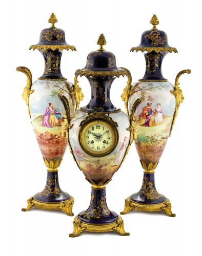 JAPY FRERES, GARNITURE DE CHEMINEE.Japy Freres, French, No. 59025. Made circa 1890..Fine and impressive, painted on porcelain and gilt-bronze.8-day going, hour and half-hour striking mantel clock with.two vases en-suite.
