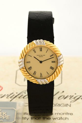 PATEK PHILIPPE, REF 4354, YELLOW AND WHITE GOLD.Patek Philippe, Genève, No. 1413281, Ref. 4354. Made in July 1987..Fine and rare, circular, 18K white and yellow gold lady's wristwatch with an 18k.Patek Philippe buckle. Accompanied by the original certific