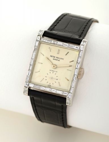 PATEK PHILIPPE, REF. 2496.PLATINUM AND.DIAMONDS RETAILED BY GUBELIN.Patek Philippe, Genève, movement No. 749076, case No. 516615, Ref. 2496.retailed by Gubelin. Made in 1958, sold on April 22nd, 1959..Very fine and rare, square, platinum and diamond-set w