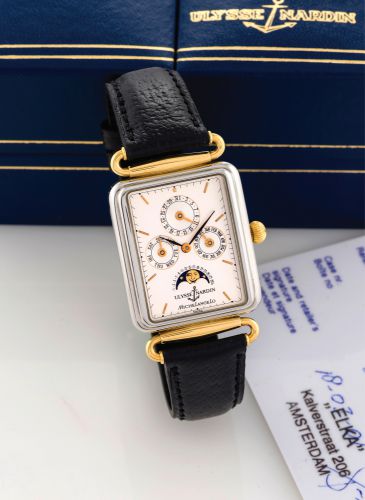 ULYSSE NARDIN - MICHELANGELO BICOLOR.Ulysse Nardin, Michelangelo Calendar Moonphase, No. 0037, Ref. 334-44. Made circa 1990..Very fine, rectangular, water-resistant, stainless steel and yellow gold wristwatch with triple-.date calendar and moon phases. Ac