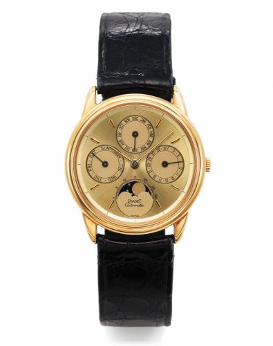 PIAGET REF. 15958 TRIPLE DATE.MOONPHASES YELLOW GOLD.Piaget, Genève, No. 491089, Ref. 15958. Made in the 1990's..Fine, astronomic, self-winding, 18K yellow gold wristwatch with.triple date, lunar calendar and moon phases, and an 18K yellow.gold Piaget buc