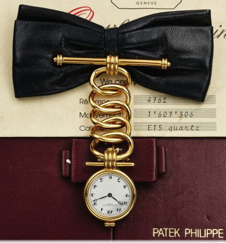 PATEK PHILIPPE REF. 4762.LEATHER BOW YELLOW GOLD.Patek Philippe & Co., Genève, No. 1607306, case No..2870567, Ref. 4762. Made in a limited edition of 50 pieces.for the 150th Anniversary of Patek Philippe in 1989..Very fine and unusual, 18K yellow gold and