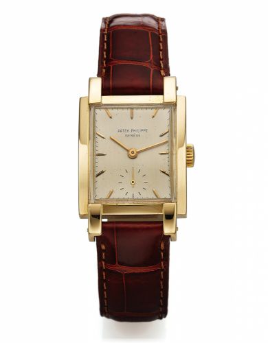 PATEK PHILIPPE REF. 2443 YELLOW GOLD.Patek Philippe, Genève, No. 971123, case No. 511171, Ref. 2443. Made in 1948, sold October 27th, 1949..Very fine and rare, rectangular curved, 18K yellow gold.wristwatch. Accompanied by the Extract from the Archives.