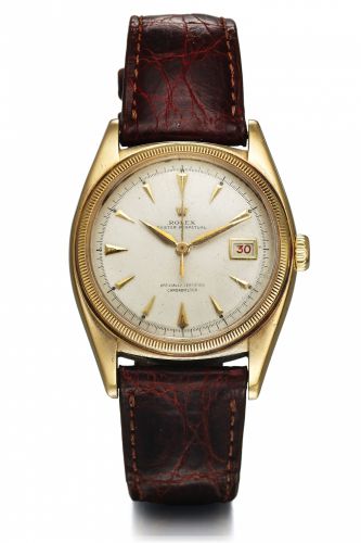 ROLEX REF. 6075 YELLOW GOLD.Rolex, Oyster Perpetual, Officially Certified Chronometer,.case No. 714313, Ref. 6075. Made in 1950s..Very fine and rare, tonneau-shaped, center seconds, self-.winding, water-resistant, 18K yellow gold wristwatch with.date.