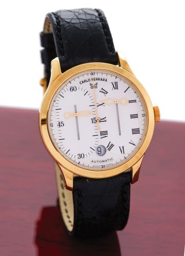 CARLO FERRARA REGOLATORE YELLOW GOLD.Carlo Ferrara, Regolatore, Automatic, No. 074/500. Made in a limited.edition of 500 pieces circa 2000..Fine and very unusual, center seconds, self-winding, water resistant.18K yellow gold wristwatch with rise and fall 