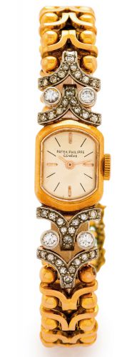 PATEK PHILIPPE - REF. 3100 - YELLOW GOLD.AND.DIAMONDS.Patek Philippe & Co., Genève, movement No. 946530, case.No. 514006, Ref. 3100 1. Made circa 1950..Fine and elegant, 18K yellow gold and diamond-set gold.lady's wristwatch with an integral 18K yellow go