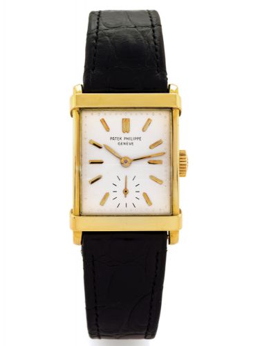 PATEK REF 2531.Patek Philippe, Genève, movement No. 976852, case No..691656, Ref. 2531. Made circa 1955..Very fine and rare, rectangular bombé, 18K yellow gold.wristwatch with an 18K yellow gold buckle.