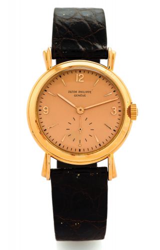 PATEK PHILIPPE REF. 2453.FLUTED LUGS PINK GOLD.Patek Philippe, Genève, No. 958715, case No. 663603, Ref. 2453. Made circa 1952..Very fine and rare, 18K pink gold wristwatch with an 18K.pink gold Patek Philippe buckle..Dial, case and movement signed.