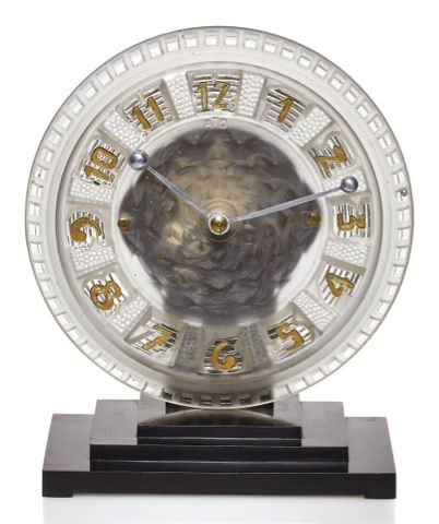 LÉON HATOT(ATO).A LA RONDE ART DECO CLOCK.Léon Hatot, (ATO), No. 97861. Made circa 1948..Fine and rare, molded glass and bakelite electric.mantel clock..Dial and movement signed.