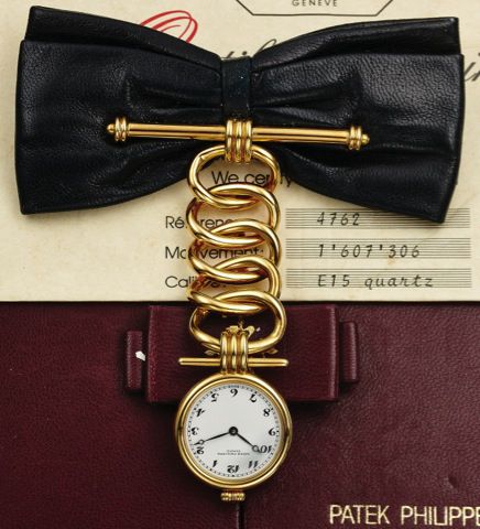 PATEK PHILIPPE REF. 4762.LEATHER BOW YELLOW GOLD.Patek Philippe & Co., Genève, No. 1607306, case No. 2870567.Ref. 4762. Made in a limited edition of 50 pieces for the 150th.Anniversary of Patek Philippe in 1989..Very fine and unusual, 18K yellow gold and 