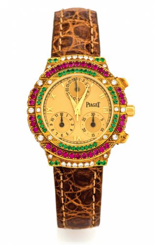 PIAGET, REF. 14071 TANAGRA GOLD.DIAMONDS, RUBIES & EMERALDS.Piaget, Genève, Tanagra, Haute Complication, No. 584824.Ref. 14071. Made in the 1990s..Fine, 18K yellow gold, diamond, ruby and emerald-set lady's.quartz wristwatch with round button chronograph,