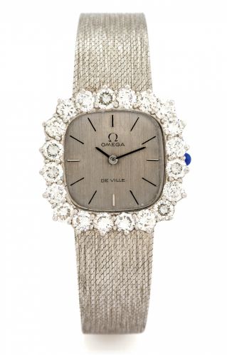OMEGA DE VILLE.LARGE.DIAMONDS & WHITE GOLD.Omega, De Ville, movement No. 24388225, Ref. 1011..Made circa 1970..Fine and very elegant, 18K white gold lady's wristwatch set with twenty large brilliant-cut white diamonds and an.integral 18K white gold textur