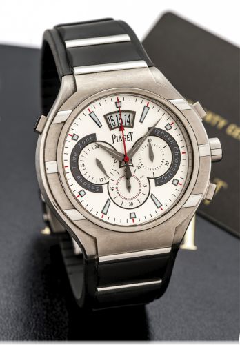 PIAGET POLO FLYBACK CHRONOGRAPH.TITANIUM AND STAINLESS STEEL.Piaget, ''Polo'', flyback chronograph two timezone, case No..1015000, Ref. P 10534. Sold in July 2011..Very fine, two time zone, self-winding, water-resistant, titanium.and stainless steel wrist