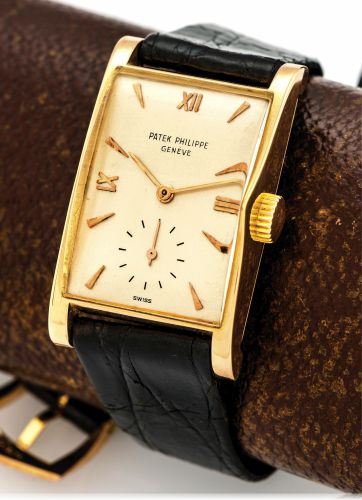 PATEK PHILIPPE REF. 1588 PINK GOLD.Patek Philippe & Co, Genève, movement No. 972839, case No..661359, Ref. 1588. Made circa 1945..Very fine and rare, rectangular curved, 18K pink gold wristwatch with a later 18k pink gold Patek Philippe buckle. Accompanie