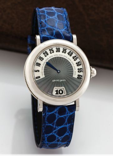 GERALD GENTA RETRO CLASSIC WHITE GOLD.Gérald Genta, Rétro Classic, case No. 79044.Ref. G 3634.7. Made in the 1990s..Fine, jump-hour, self-winding, water-resistant, 18K white.gold wristwatch with retrograde minutes and a Gerald Genta.18K white gold buckle.