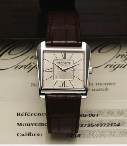 PATEK PHILIPPE REF. 5489 WHITE GOLD.Patek Philippe & Cie, Geneve, No. 1343735, case No. 4372124.Ref. 5489G. Sold August 28th, 2008..Fine and unusual, asymmetric trapezoidal, 18K white gold.wristwatch with an 18K white gold Patek Philippe buckle..Accompani