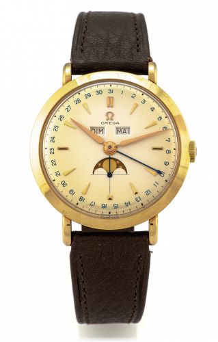 OMEGA REF. 2485 TRIPLE DATE MOON PHASES.COSMIC YELLOW GOLD.Omega, No. 12593127, case No. 11032667, Ref. 2485..Made circa 1950..Fine and rare, 14K yellow gold wristwatch with triple date.calendar, moon phases and a gold-plated Omega buckle..Dial, case and 