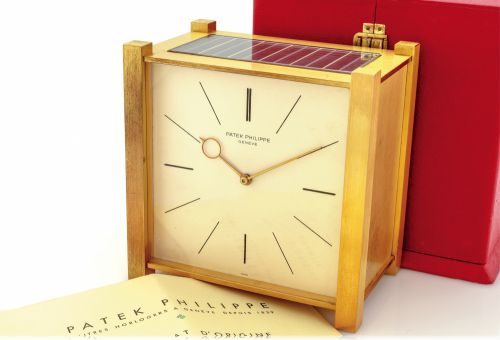 PATEK PHILIPPE SOLAR CLOCK.ORIGINAL BOX & CERTIFICATE.Patek Philippe, Genève, case No. 966, movement No. 873425.Ref. 902.50. Made in the 1960s..Fine and rare, solar-powered gilt-brass table clock with solar.powered electric winding system. Accompanied by 