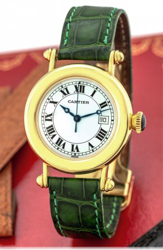 CARTIER DIABOLO YELLOW GOLD.Cartier, Paris, Diabolo, No. R1806, Ref: 1420 0. Made in.the 1990s..Fine, water-resistant, center-seconds, 18K yellow gold.quartz wristwatch with date and an 18K yellow gold.Cartier deployant clasp. Accompanied by a Cartier fit