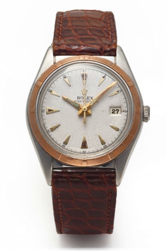 ROLEX REF. 5031 STEEL AND GOLD.Rolex, Oyster Perpetual, Officially Certified.Chronometer, case No. 613686, Ref. 5031. Made in 1949..Fine and rare, tonneau-shaped, center seconds, self-.winding, water resistant, 18K yellow gold and stainless.steel chronome