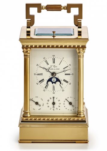 L'EPEE LUNAR CALENDAR.CARRIAGE CLOCK WITH ALARM.L'Epée, France. Made in the late 20th century..Fine, gold-plated, hour and half-hour striking, carriage.clock with day-date calendar, alarm, moon phases and lunar.calendar.