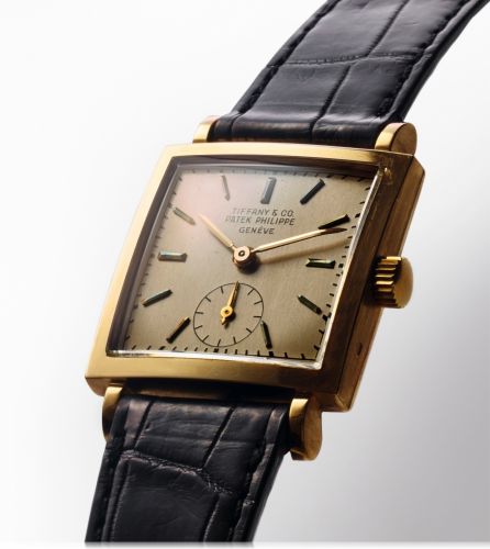 PATEK PHILIPPE REF. 1431 RETAILED BY TIFFANY YELLOW GOLD.Patek Philippe & Co, Genève, No.955855, case No. 664918, Ref. 1431. Sold on July 24th, 1951..Fine, square, 18K yellow gold wristwatch with an 18K yellow gold Patek Philippe buckle..Accompanied by an