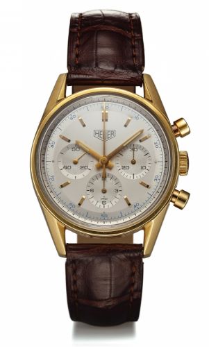 HEUER REF. CS3140 RE-EDITION.CHRONOGRAPH YELLOW GOLD.Heuer Chronograph, Carrera, 1964 re-edition movement.No. 4520072, No. 1259, Ref. CS3140. Made in a numbered.series circa 1996..Fine, water resistant, 18K yellow gold wristwatch with round.button chronog