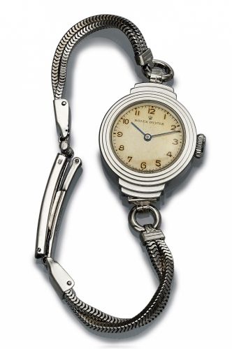 ROLEX REF. 3489.OYSTER LADY'S STEEL.Rolex, Oyster, case No. 206635, Ref. 3489. Made in the late 1920s. Fine and.very rare, water-resistant, stainless steel.lady's wristwatch with a gold-plated.rope bracelet and clasp..Dial, case and movement signed.