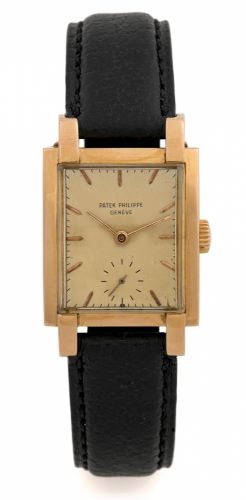 PATEK PHILIPPE REF. 2443 ROSE GOLD.Patek Philippe, Genève, No. 972088, case No. 511450, Ref. 2443..Made in 1948..Very fine and rare, rectangular curved, 18K rose gold.wristwatch with an 18K rose gold Patek Philippe buckle.