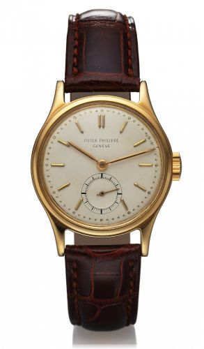 PATEK PHILIPPE REF. 2451 CALATRAVA.Patek Philippe, Geneve, No. 955731, case No. 633205.Ref. 2451. Made in the 1950s..Fine and rare, midsize, water-resistant, 18K yellow gold.wristwatch.