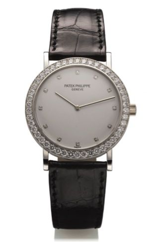PATEK PHILIPPE REF. 5006.WHITE GOLD AND.DIAMONDS.Patek Philippe, Genève, No. 1340390, case No. 2922700.Ref. 5006G. Made in 1992..Very fine and elegant, rare, 18K white gold and diamond.wristwatch with an 18K white gold Patek Philippe buckle..Accompanied b