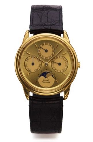 PIAGET REF. 15958 TRIPLE DATE.MOONPHASES YELLOW GOLD.Piaget, Genève, No. 491089, Ref. 15958. Made in the 1990's..Fine, astronomic, self-winding, 18K yellow gold wristwatch with triple date, lunar calendar and moon phases, and an 18K.yellow gold Piaget buc