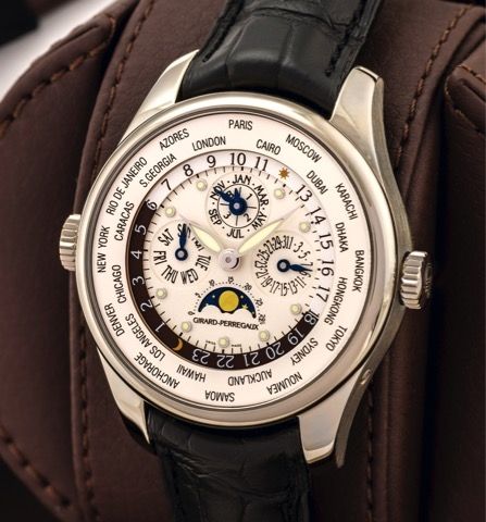 GIRARD-PERREGAUX, REF. 90280 WORLD TIME.PERPETUAL CALENDAR WHITE GOLD.Girard-Perregaux, World Time Perpetual Calendar, No. OG 104, Ref. 90280. Made circa 2010..Very fine, self-winding, water-resistant, 18K white gold world-time.wristwatch with perpetual c