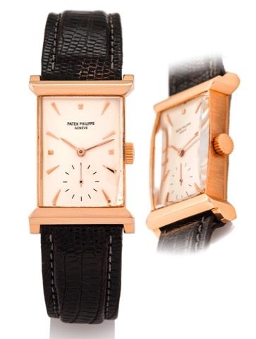 PATEK PHILIPPE REF. 2404 PINK GOLD.Patek Philippe, Genève, No. 975992, case No. 678777.Ref. 2404. Made in 1954, sold on August 30, 1956..Very fine and rare, rectangular, 18K pink gold wristwatch with an 18K pink gold buckle.