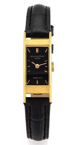 PATEK PHILIPPE REF. 2292 LADY'S RECTANGULAR.Patek Philippe, Genève, retailed by Shreve & Co., movement.No. 843608, case No. 686767, Ref. 2292. Made in 1955.sold on September 16th, 1955..Very fine and rare, lady's rectangular, bombé, 18K yellow gold wristw