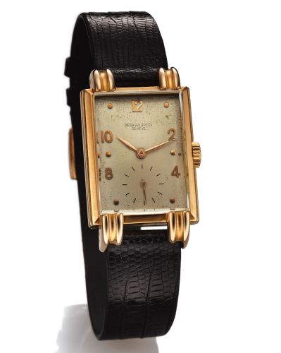 PATEK PHILIPPE REF. 1480.LARGE FLUTED LUGS PINK GOLD.Patek Philippe & Co., Genève, No. 836807, case No. 508952.Ref. 1480. Made in 1944..Very fine and rare, rectangular cueved, 18K pink gold wristwatch with fancy lugs and an 18K pink gold Patek Philippe bu