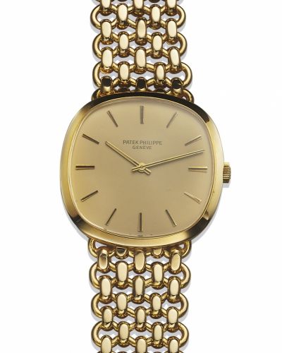 PATEK PHILIPPE REF. 3544 YELLOW GOLD.Patek Philippe, Genève, No. 1212439, case No. 2714371.Ref. 3544/2. Made in the 1970s..Fine, cushion-shaped, 18K yellow gold wristwatch with an.integral 18K yellow gold Patek Philippe bracelet.